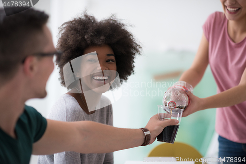 Image of multiethnic group of young people have a lunch break
