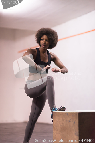 Image of black woman are preparing for box jumps at gym