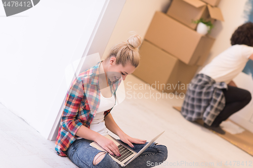 Image of Happy couple doing home renovations