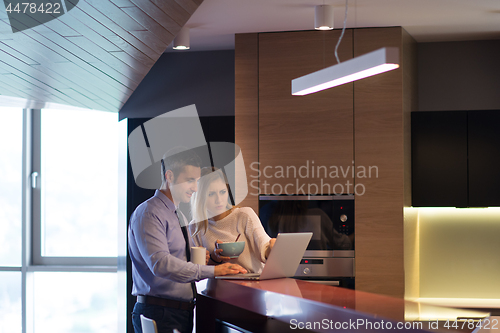 Image of A young couple is preparing for a job and using a laptop