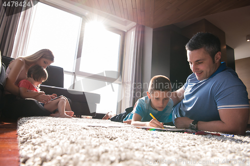 Image of young couple spending time with kids