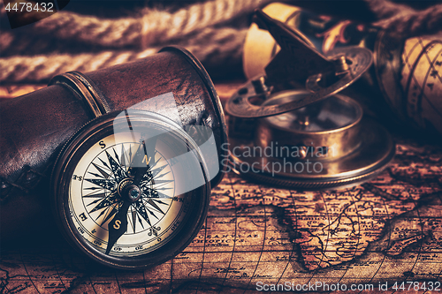 Image of Old vintage compass on ancient map