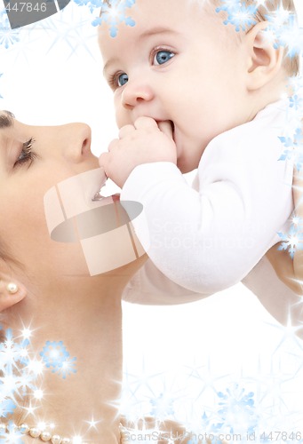 Image of happy mother playing with baby boy