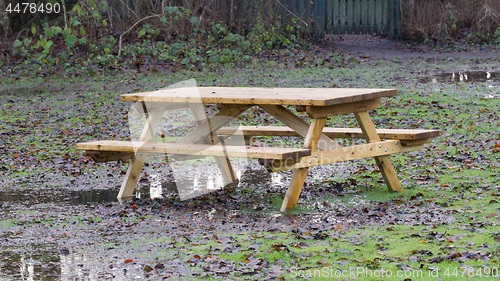 Image of Wooden picknickplace on a green field