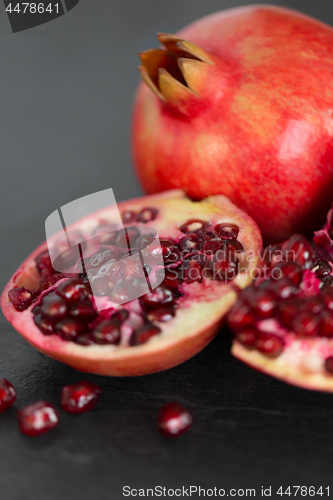 Image of close up of pomegranate on stone table