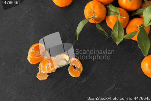 Image of close up of mandarins on slate table top