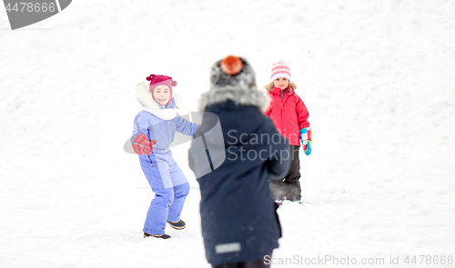 Image of happy little kids playing outdoors in winter