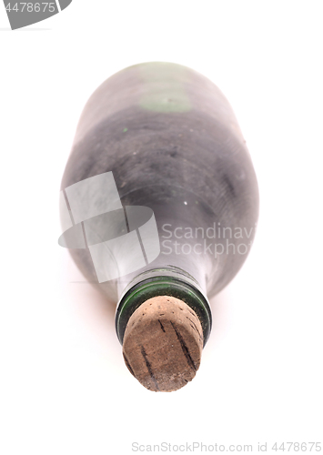 Image of Old bottle of wine, covered in dust, selective focus