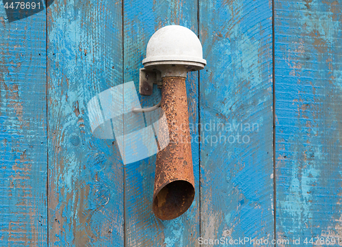 Image of Alarm horn hanging on a blue wall