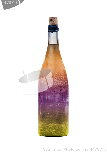 Image of Old bottle of colorful liquid, covered in dust