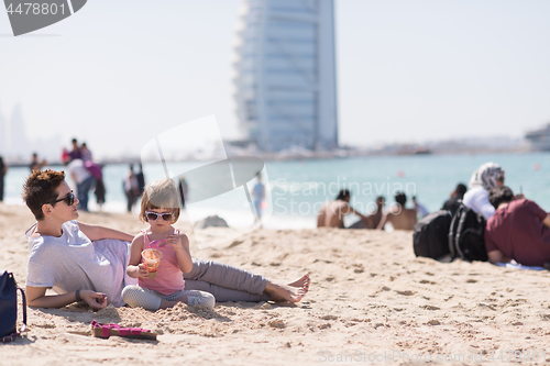 Image of Mom and daughter on the beach