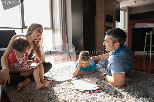 Image of young couple spending time with kids