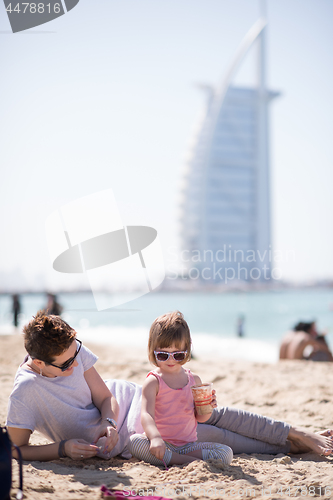 Image of Mom and daughter on the beach