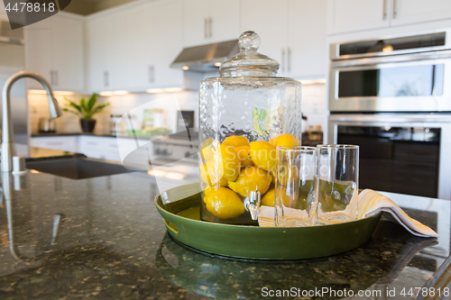 Image of Abstract of Interior Kitchen Counter with Lemon Filled Pitcher a