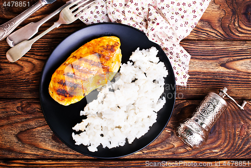 Image of boiled rice with fried chicken breast