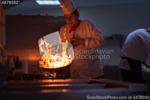 Image of Chef doing flambe on food