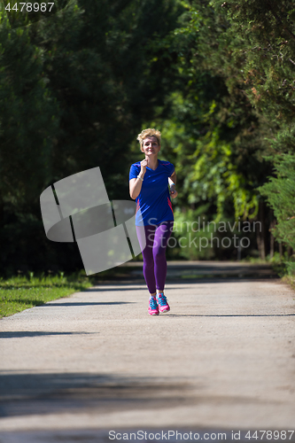 Image of young female runner training for marathon