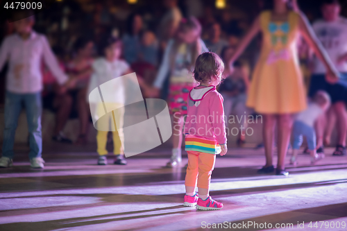 Image of little girl dancing in the kids disco