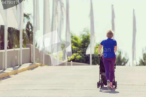 Image of mom with baby stroller jogging