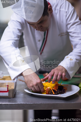 Image of chef serving vegetable salad