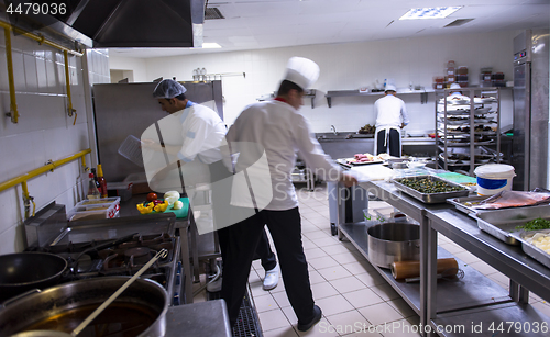 Image of team cooks and chefs preparing meals