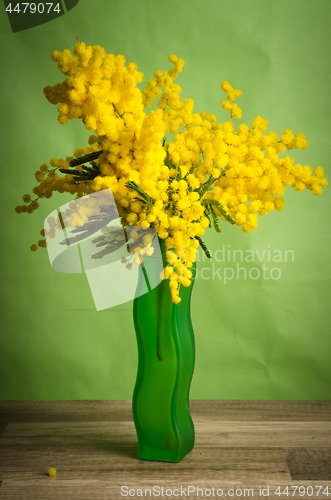 Image of Spring bouquet with mimosa and tulips in a vase