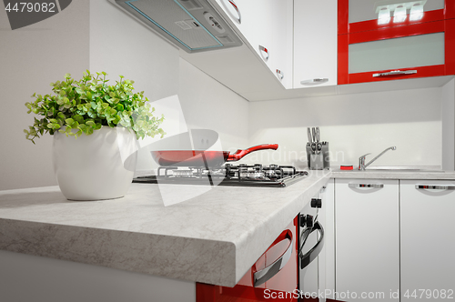 Image of Modern red and white kitchen interior