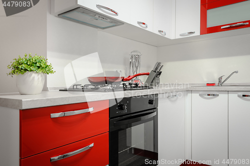 Image of Modern red and white kitchen interior