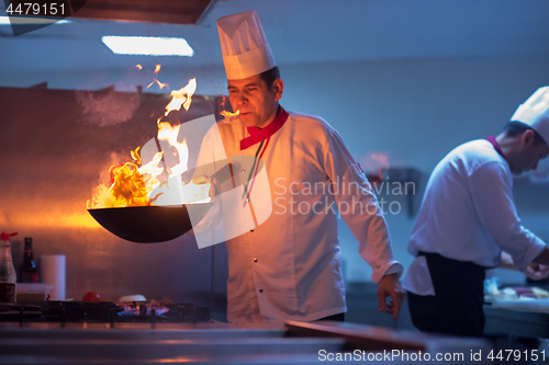 Image of Chef doing flambe on food