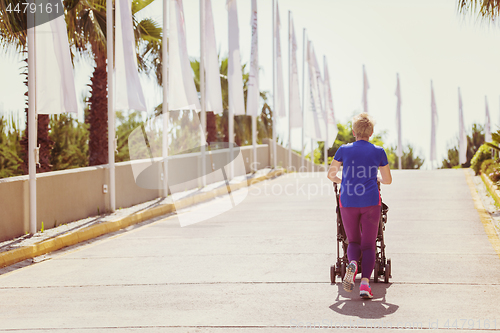 Image of mom with baby stroller jogging