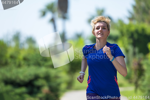 Image of young female runner training for marathon