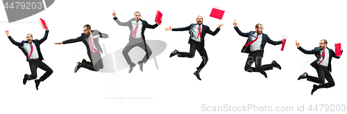 Image of Funny cheerful businessman jumping in air over white background