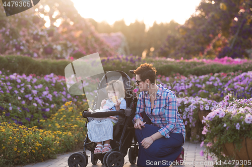 Image of mother and daughter in flower garden