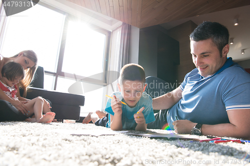 Image of young couple spending time with kids