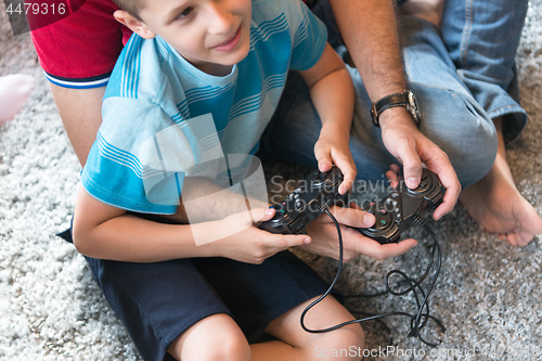 Image of Happy family playing a video game