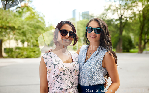 Image of portrait of happy women or friends at summer park
