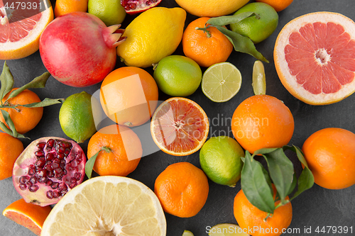 Image of close up of citrus fruits on stone table