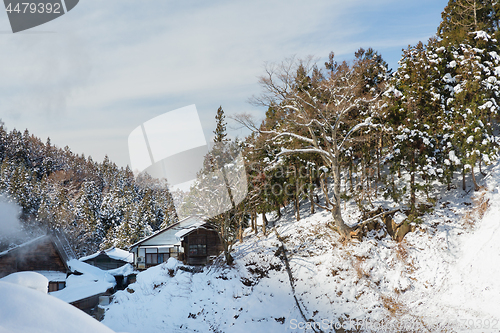 Image of country houses and forest hills in winter, japan