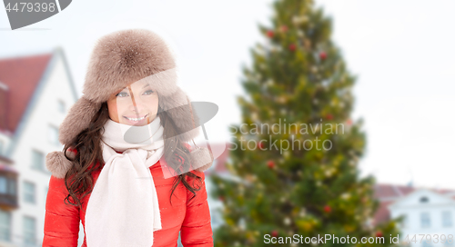 Image of happy woman over christmas tree in tallinn