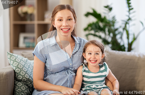 Image of pregnant mother and daughter at home