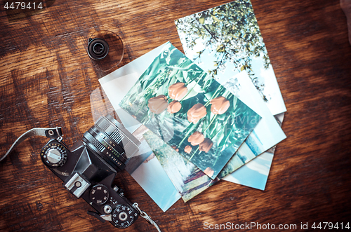 Image of Old photo film roll and retro camera on desk