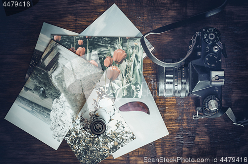 Image of Old photo film roll and retro camera on desk