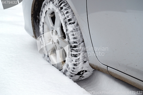 Image of Car tyre in snow