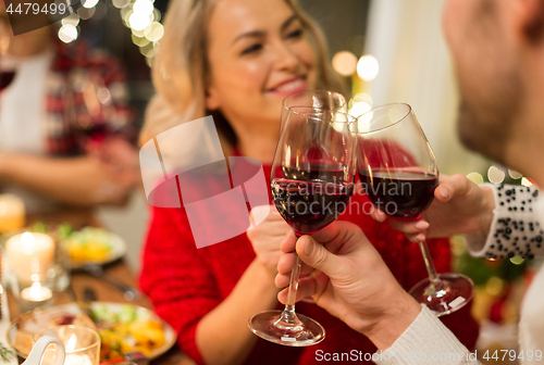 Image of close up of friends with wine celebrate christmas