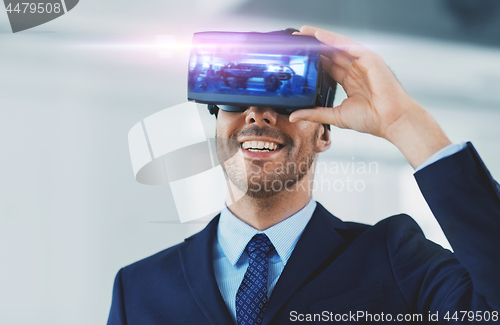 Image of businessman with virtual reality headset at office