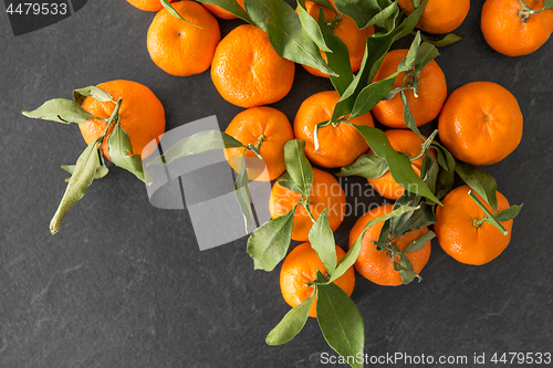 Image of close up of mandarins on slate table top