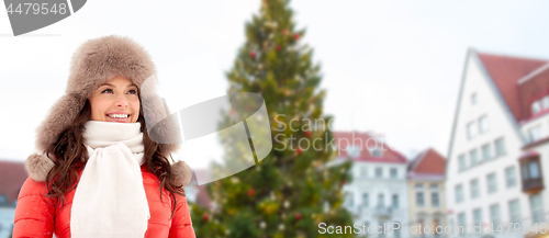 Image of happy woman over christmas tree in tallinn