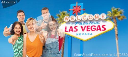 Image of friends pointing at you over las vegas sign