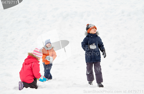 Image of happy little kids playing outdoors in winter