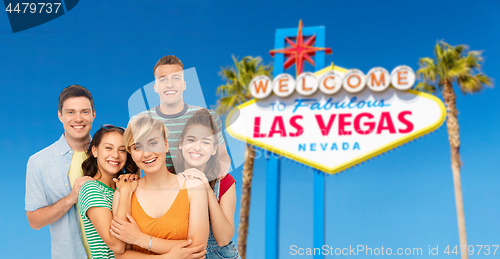 Image of happy friends over las vegas sign background